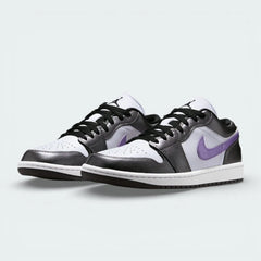 Angled shot of both Air Jordan 1 Low SE trainers, showcasing the luxurious material mix and the sleek, low-profile silhouette.