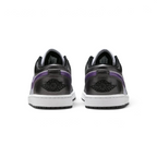Rear view focusing on the meticulously embroidered Wings logo on the heel counter and the structured leather finish.