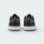 Rear view focusing on the meticulously embroidered Wings logo on the heel counter and the structured leather finish.