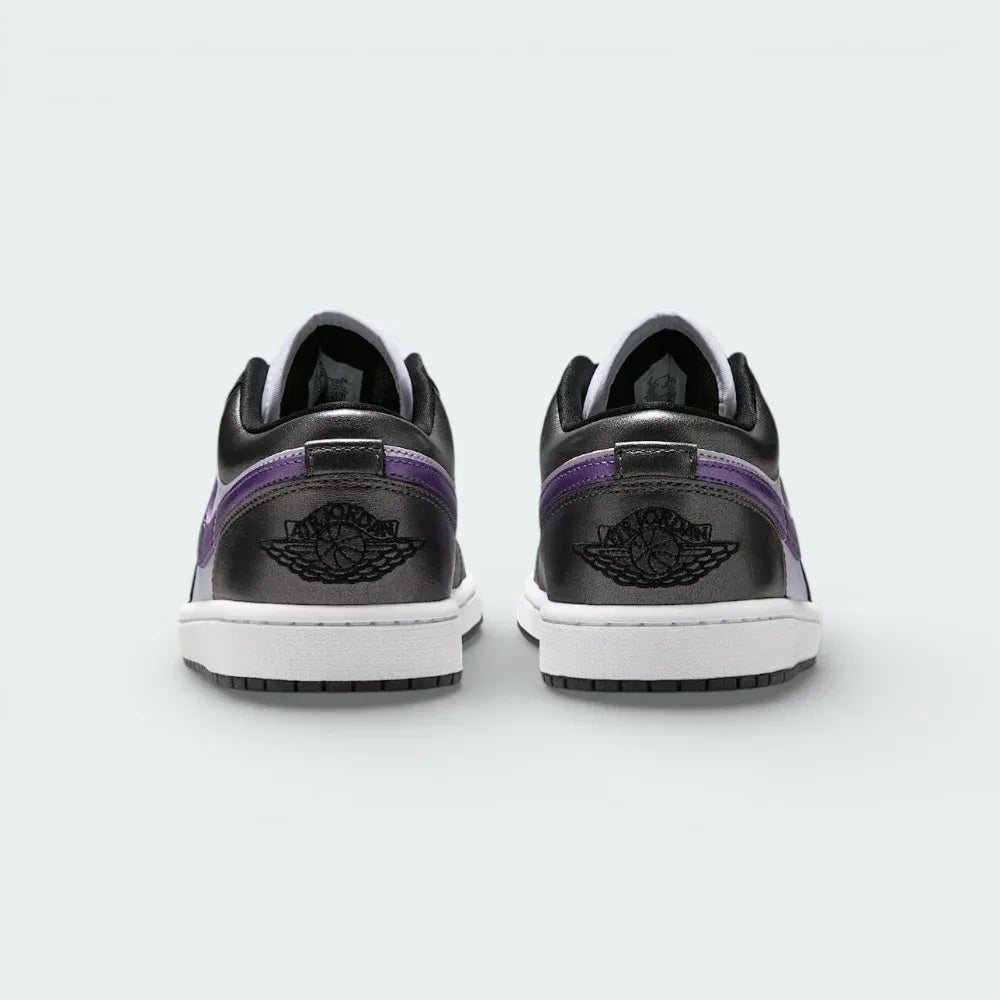 Rear view focusing on the meticulously embroidered Wings logo on the heel counter and the structured leather finish.