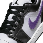 Close-up of the front, showing the quality of the white leather grain and the precision stitching around the toe cap.
