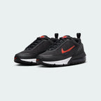 Angled view of two Nike Air Max Pulse Juniors' trainers in black and red, side by side, showcasing their bold design and visible Air unit.
