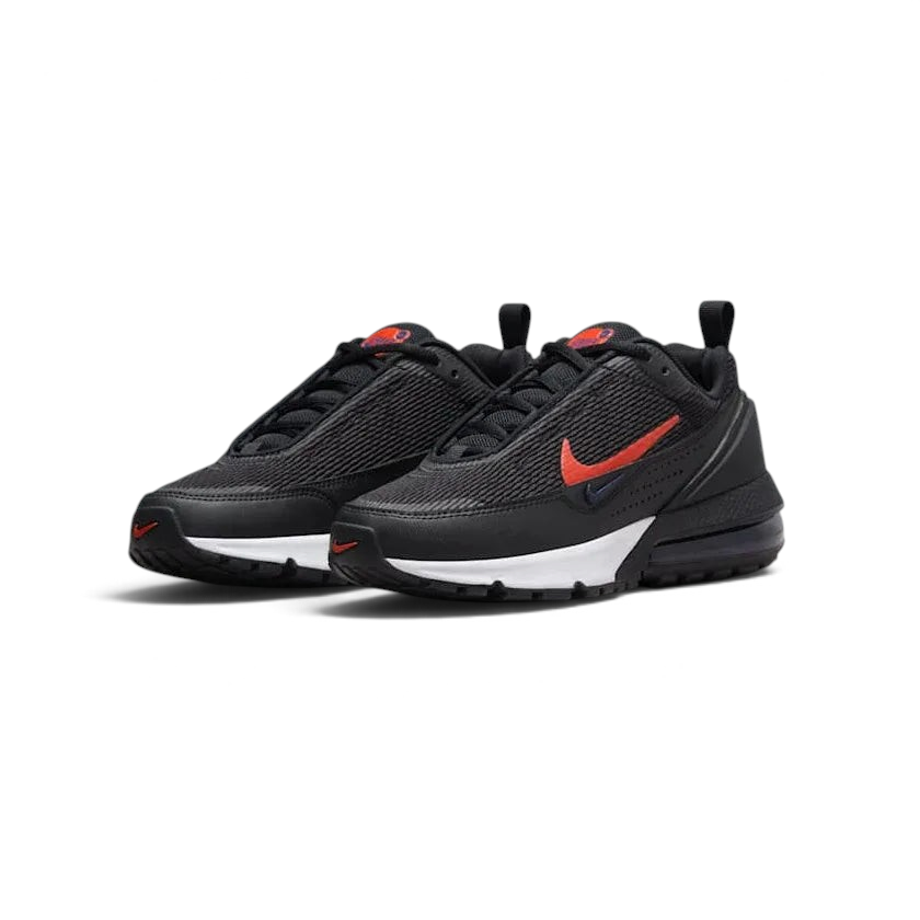 Angled view of two Nike Air Max Pulse Juniors' trainers in black and red, side by side, showcasing their bold design and visible Air unit.