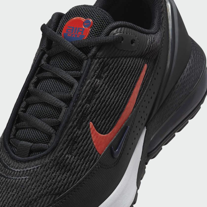 Close-up zoom on the front of the Nike Air Max Pulse Juniors' trainers, showing the mesh toe box, lacing system, and synthetic overlays.