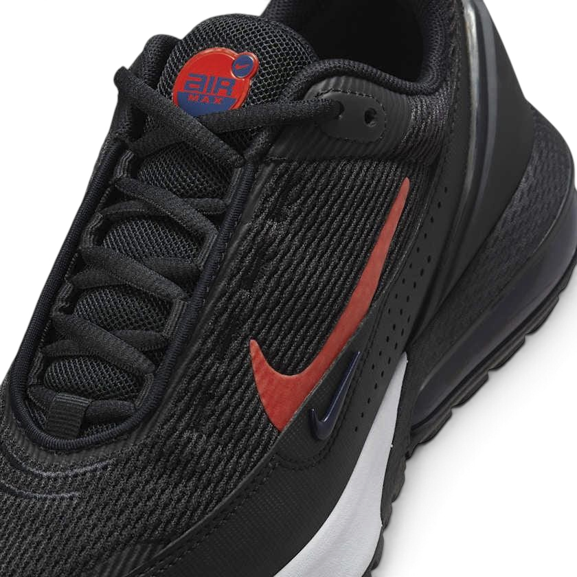 Close-up zoom on the front of the Nike Air Max Pulse Juniors' trainers, showing the mesh toe box, lacing system, and synthetic overlays.