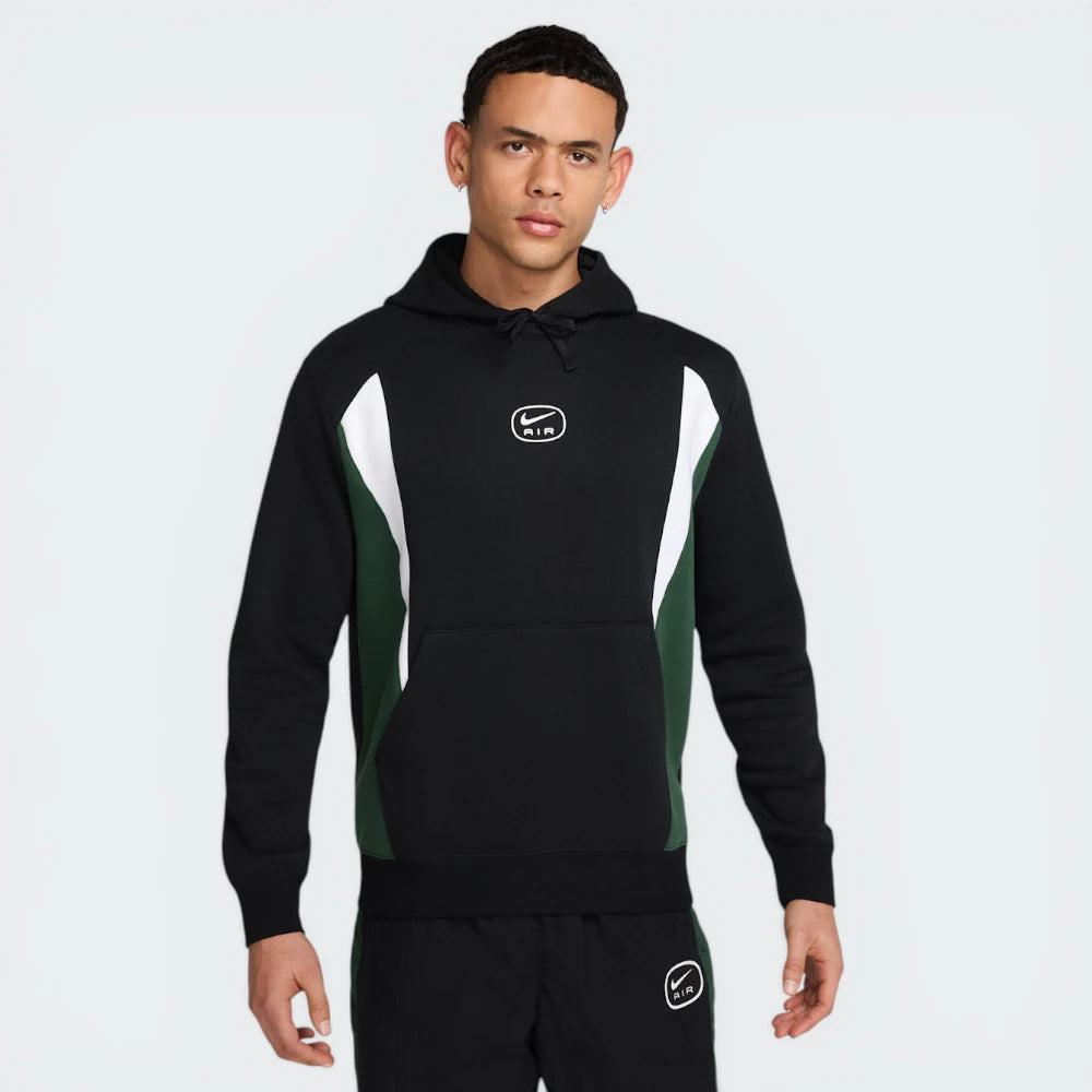 The Black and Fir hoodie, highlighting the colour-blocked sleeves and the clean drape of the midweight fleece.
