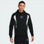 The Black and Fir hoodie, highlighting the colour-blocked sleeves and the clean drape of the midweight fleece.