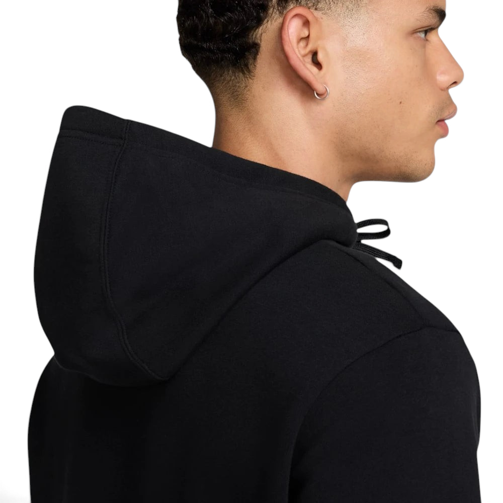 Emphasizing the contrast between the black body and the deep fir green sleeves.