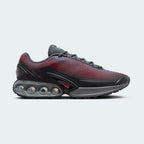 Nike Air Max DN Men's Black Trainers HM0708-002 side view showing streamlined black upper and dual-chamber Air unit in heel