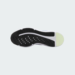 View of the outsole of the Nike Cosmic Runner Juniors' blue running trainers, showing the durable rubber tread pattern for multi-surface traction.