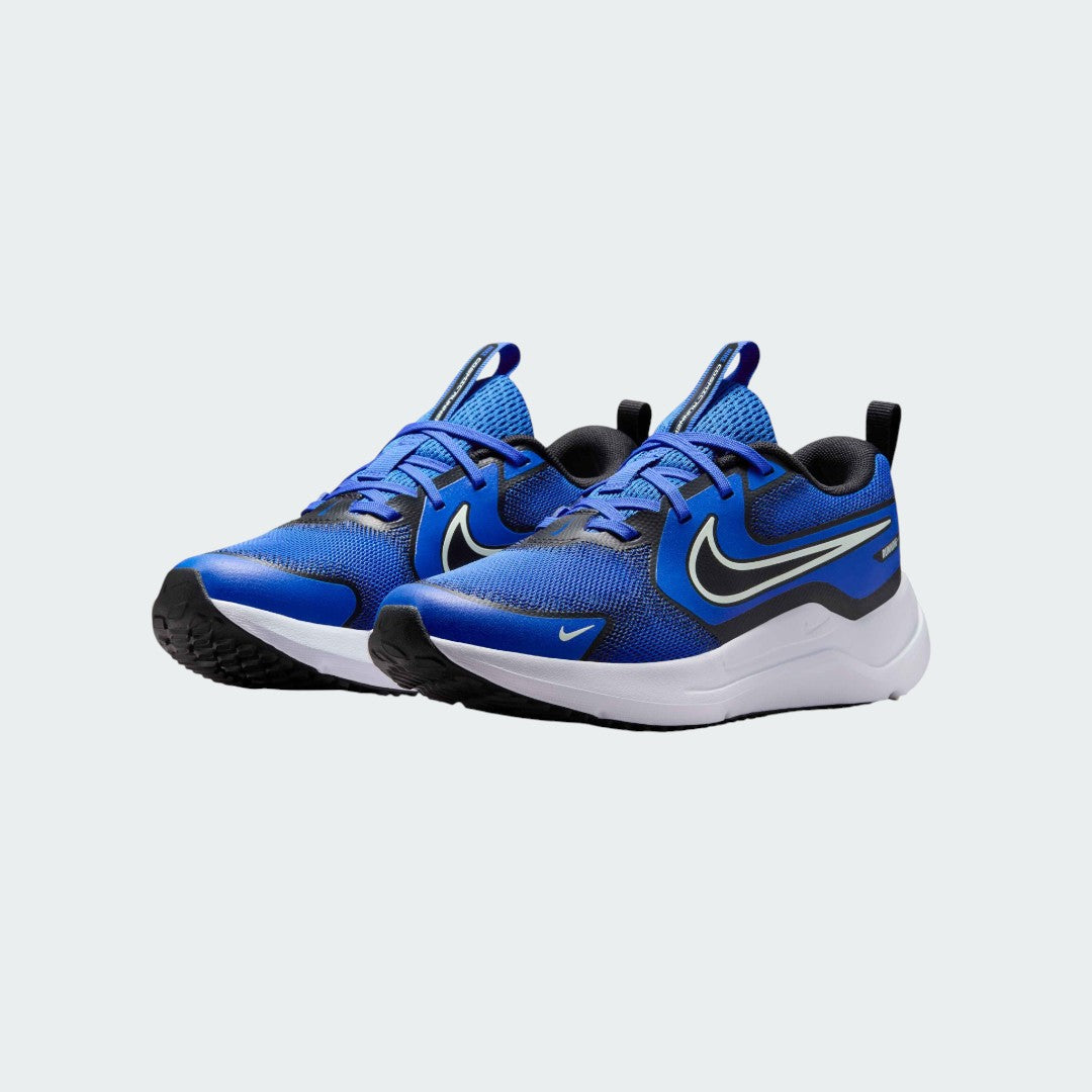 Angled view of two Nike Cosmic Runner Juniors' blue trainers, side by side, showcasing their versatile design and cushioned profile.