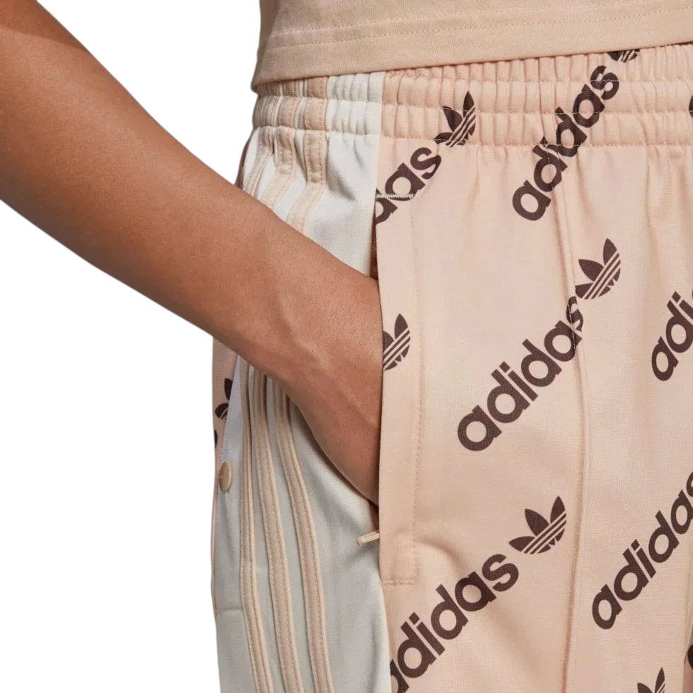 Trade Sports Adidas Adibreak track pants in halo blush with monogram logo print and side snap button detail