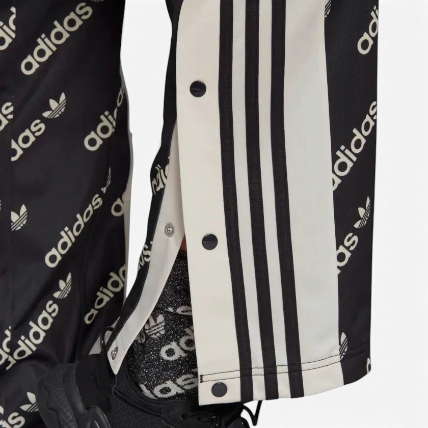 Close up showing the poppers open at the foot of the pants