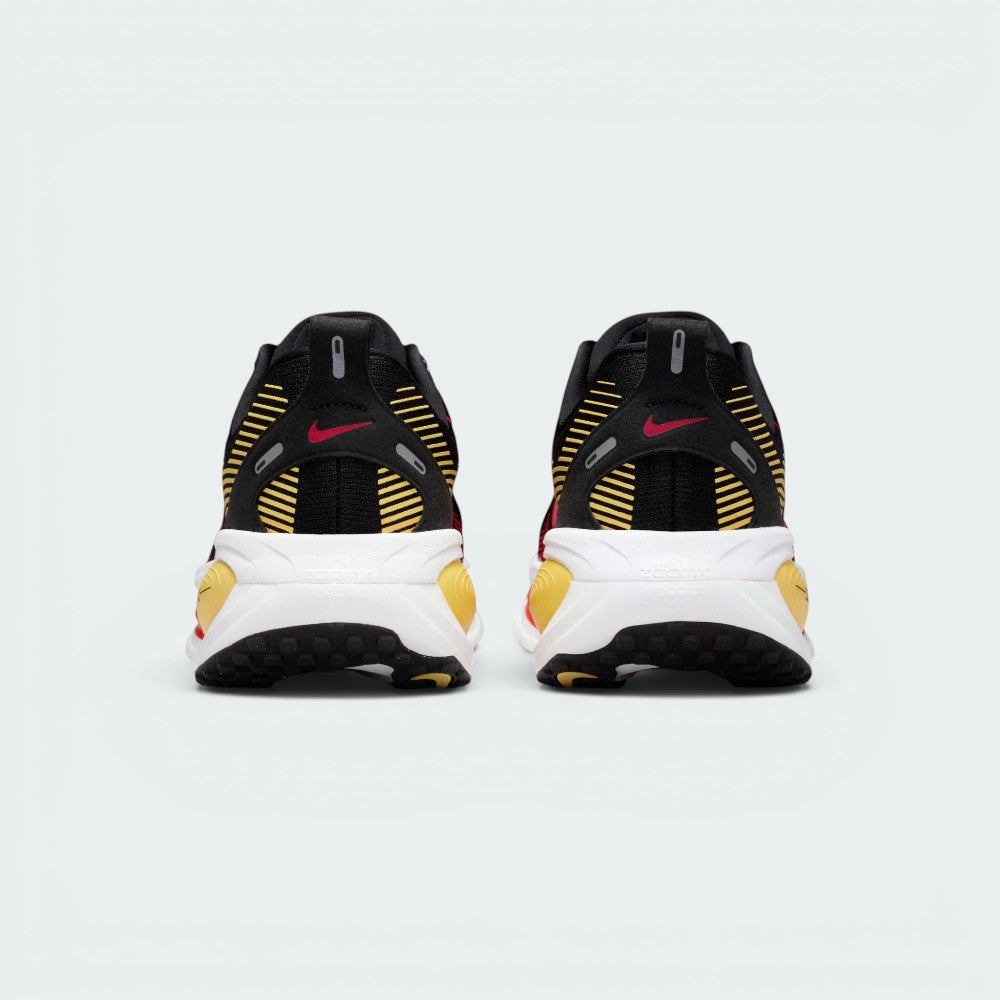 Focuses on the contoured shape of the padded ankle collar, highlighting the thick plush heel lining and the robust, wide footprint of the ReactX sole unit engineered for maximum landing stability.