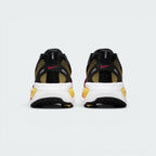 Focuses on the contoured shape of the padded ankle collar, highlighting the thick plush heel lining and the robust, wide footprint of the ReactX sole unit engineered for maximum landing stability.