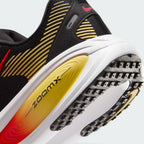 Highlights the "unreal" clean finish where the responsive ReactX foam carrier meets the ZoomX top layer, framing the technical compression lines of the cushioning package.