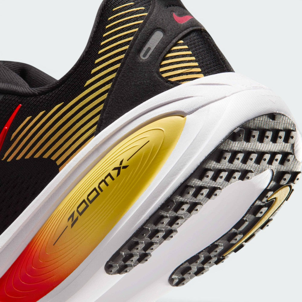 Highlights the "unreal" clean finish where the responsive ReactX foam carrier meets the ZoomX top layer, framing the technical compression lines of the cushioning package.