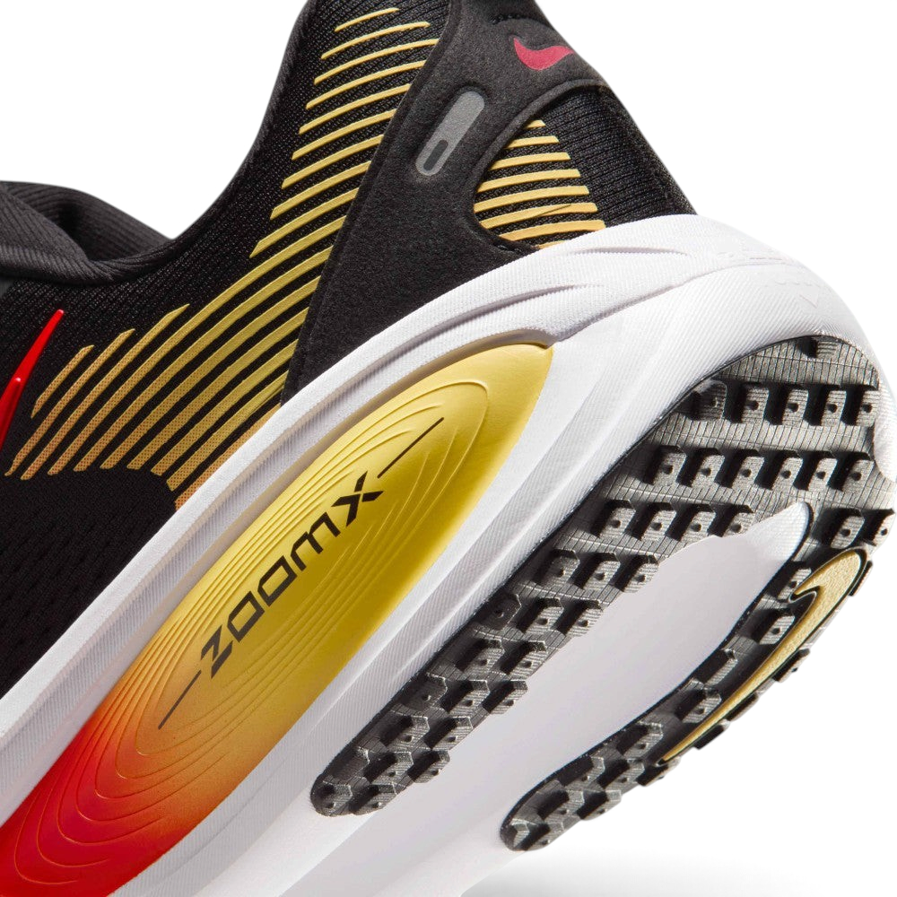 Highlights the "unreal" clean finish where the responsive ReactX foam carrier meets the ZoomX top layer, framing the technical compression lines of the cushioning package.