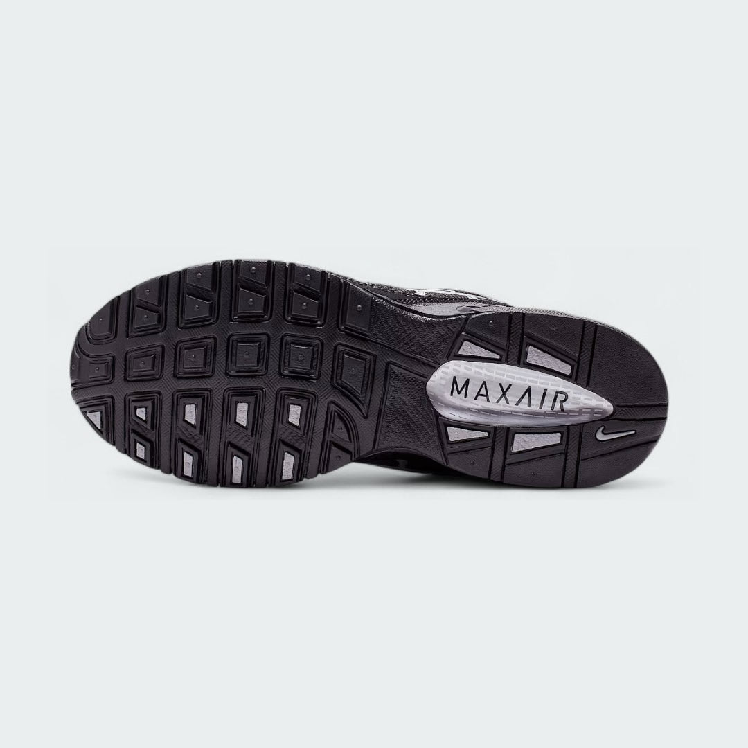View of the outsole of the Nike Air Max Torch Men's black running trainers, showing the durable rubber tread pattern for road traction.