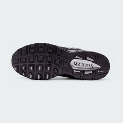 View of the outsole of the Nike Air Max Torch Men's black running trainers, showing the durable rubber tread pattern for road traction.