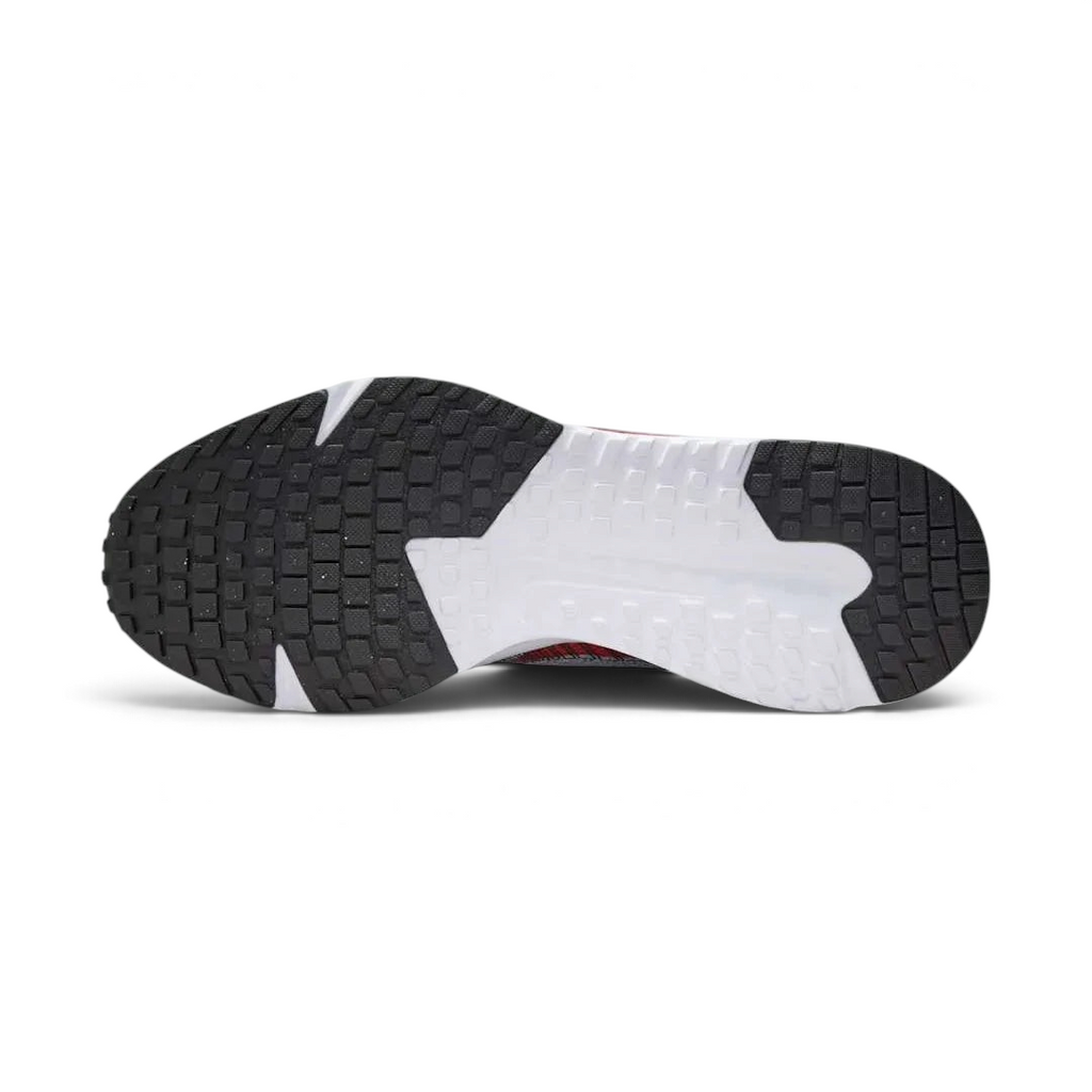 Trade Sports Nike Run Defy running shoe showing the durable black and white multi-surface rubber outsole tread.