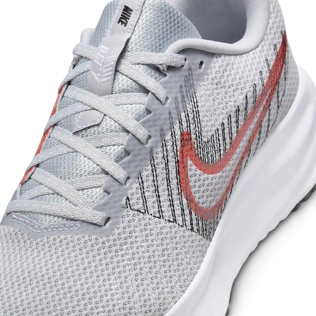 Trade Sports Nike Run Defy men's running trainers in wolf grey mesh with a bright crimson Swoosh and white midsole.