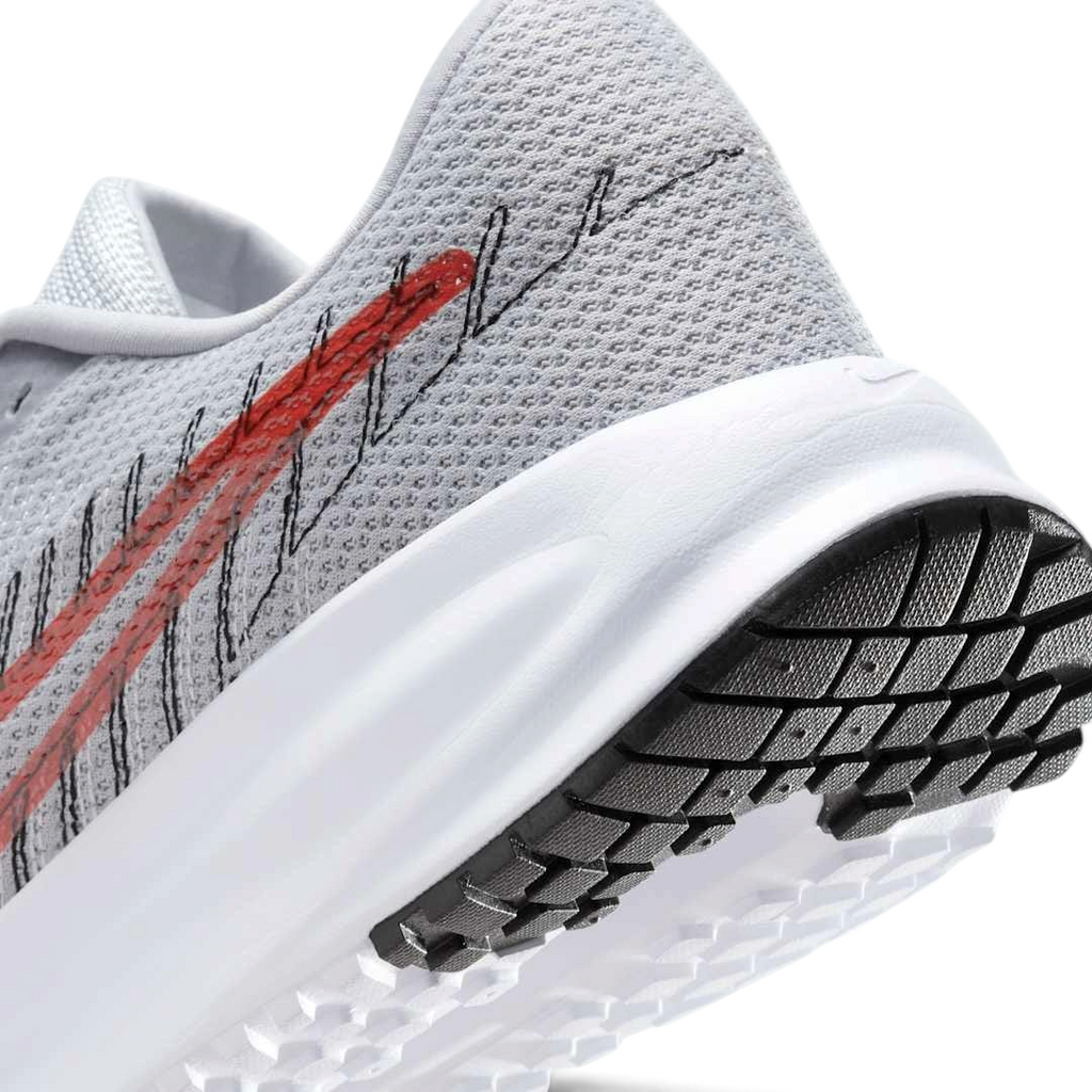 Trade Sports Nike Run Defy men's running trainer in wolf grey mesh with a bright crimson swoosh and white foam sole.