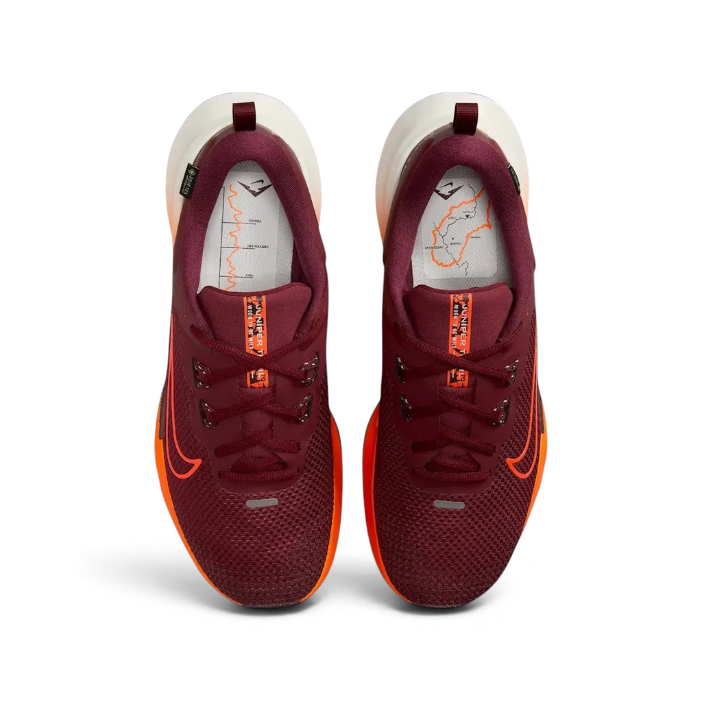 Top-down view of a pair of Nike Juniper Trail 2 GORE-TEX V2 men's trail shoes in burgundy, highlighting their durable construction and lace-up closure.