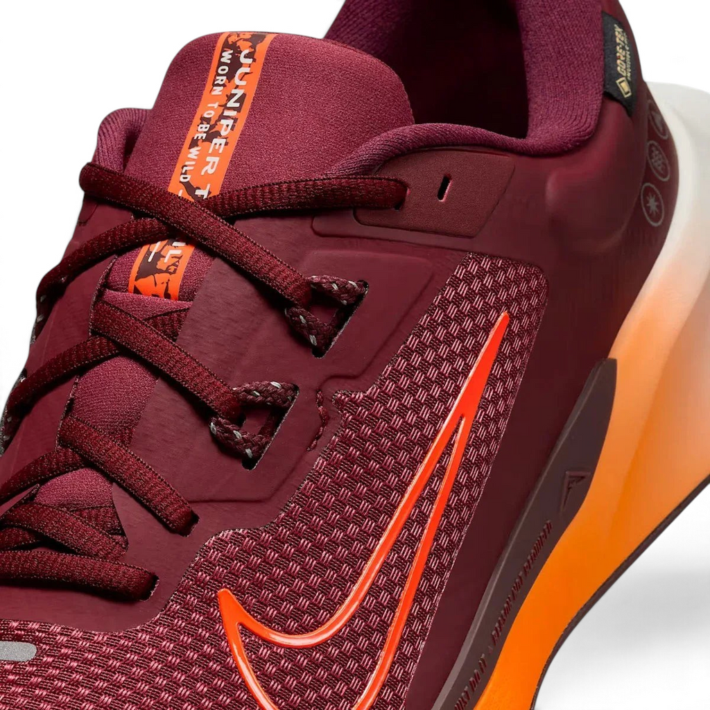 Close-up zoom on the front of the Nike Juniper Trail 2 GORE-TEX V2 men's trail shoes, showing the reinforced toe cap, mesh upper texture, and lacing system.