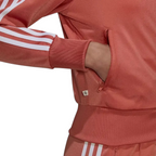Close-up zoom of the open zip pocket in use with cuffed sleeves