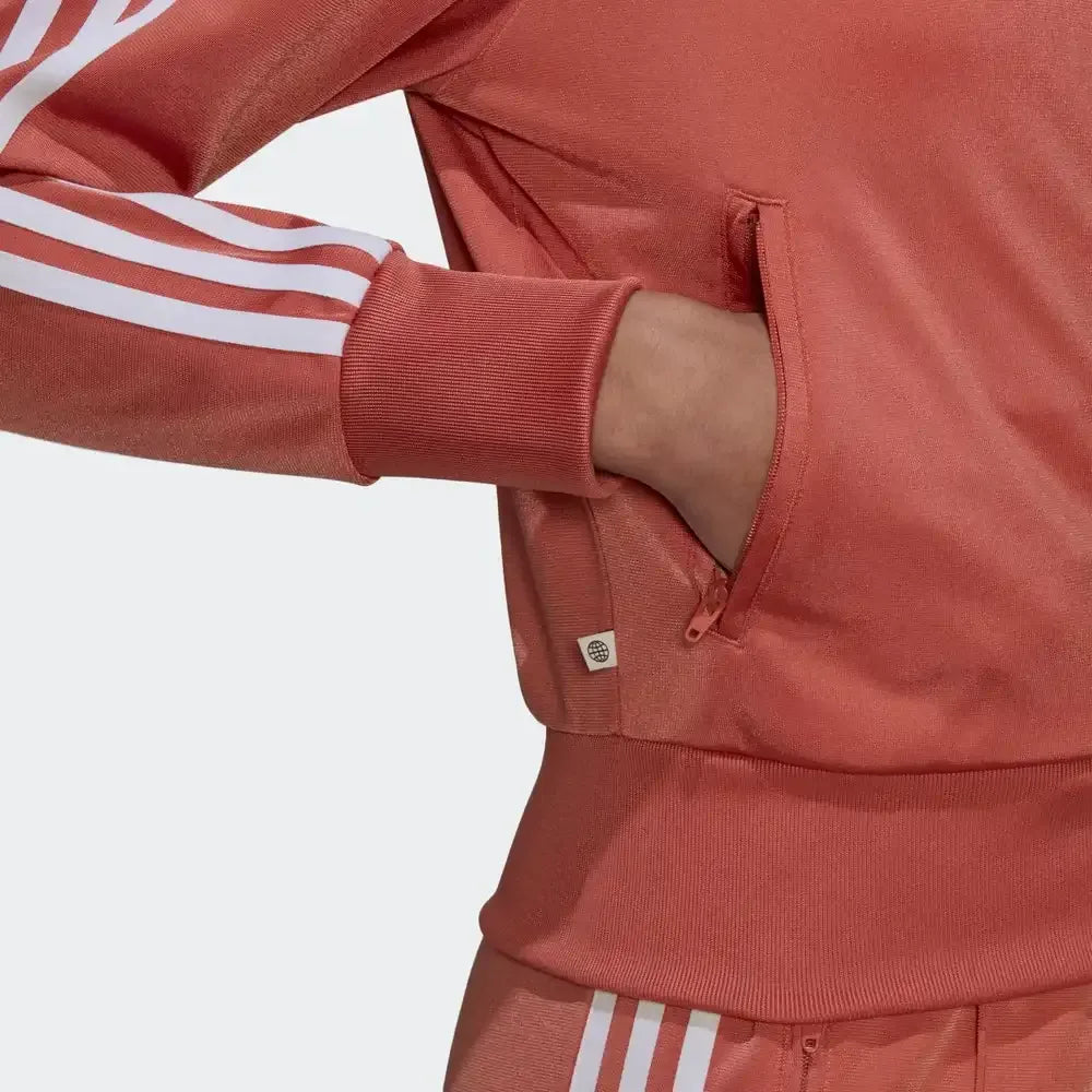 Close-up zoom of the open zip pocket in use with cuffed sleeves