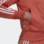 Close-up zoom of the open zip pocket in use with cuffed sleeves
