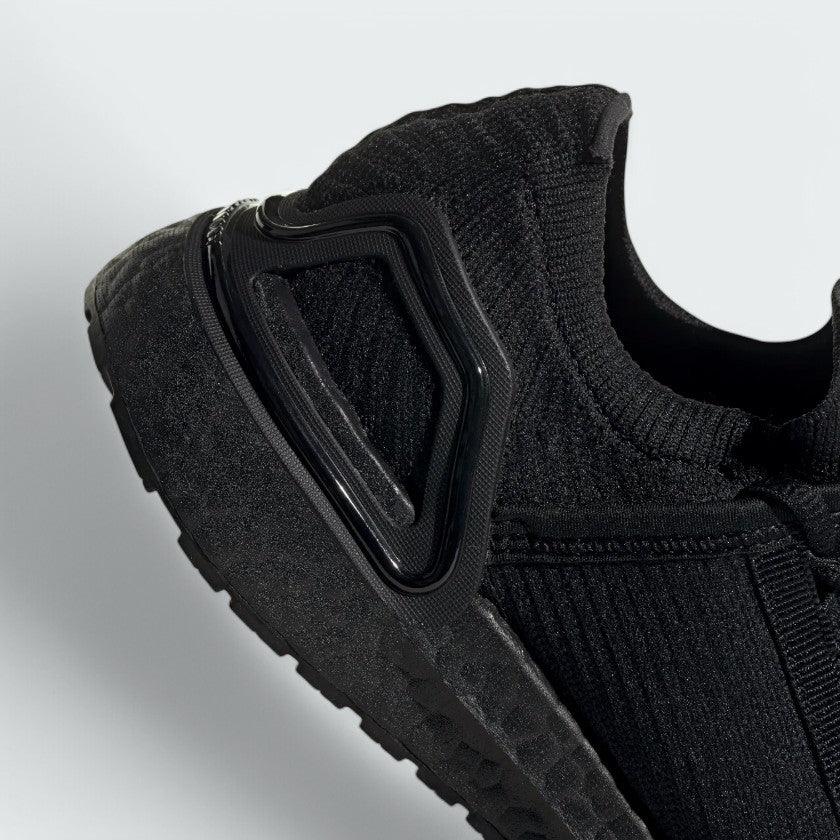 Detailed zoom on the outsole and midsole of the Adidas by Stella McCartney Ultra Boost 20 trainers, highlighting the Boost cushioning pellets and rubber tread.