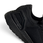 Detailed zoom on the outsole and midsole of the Adidas by Stella McCartney Ultra Boost 20 trainers, highlighting the Boost cushioning pellets and rubber tread.