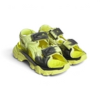 Angled view of two Adidas by Stella McCartney Hika Sandals in yellow and black, side by side, showcasing their robust yet stylish design.