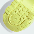 Rear view of the Adidas by Stella McCartney Hika Sandals in yellow, focusing on the heel strap and branding.