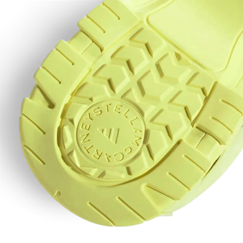 Rear view of the Adidas by Stella McCartney Hika Sandals in yellow, focusing on the heel strap and branding.