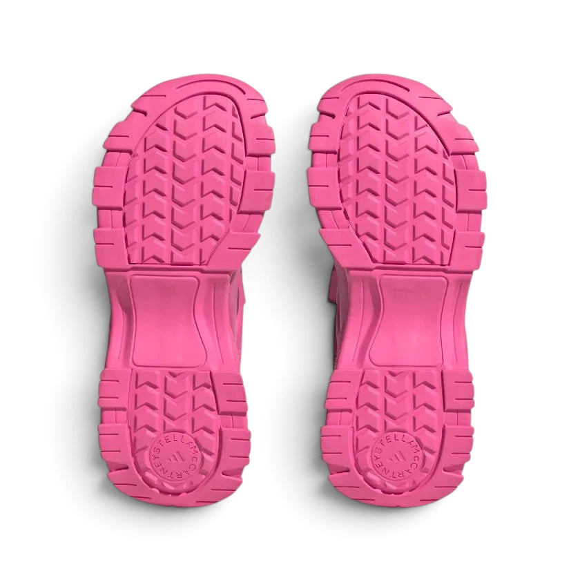 View of the outsole of the Adidas by Stella McCartney Hika Sandals in pink, showing the durable tread pattern for grip.