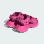 Angled view of two from the rear Adidas by Stella McCartney Hika Sandals in pink, side by side, showcasing their robust yet stylish design.
