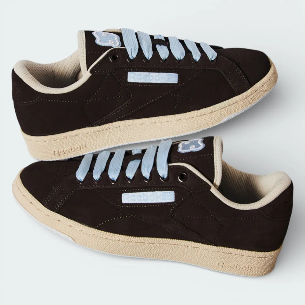 Close-up of the front, showing the fine detail of the Earth brown suede toe box and the crisp white eyelets.