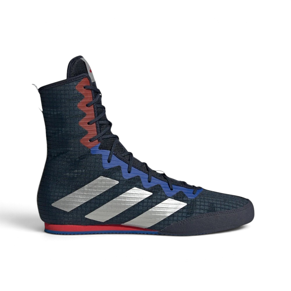 Highlights the high-velocity sweep of the Silver Metallic 3-Stripes, showing the breathable mesh depth of the Legend Ink upper rising into the supportive mid-cut ankle collar above the grey EVA foam wedge. Main image