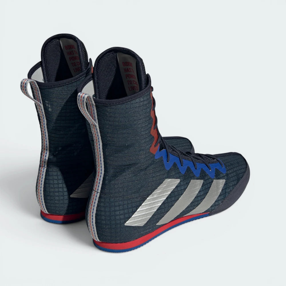 Focuses on the contoured shape of the deep navy heel counter, showing a clean stitched vertical spine built to keep ankles completely supported.