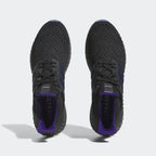 Top-down view of a pair of Adidas Ultra 4D x Rich Mnisi Pride men's trainers, highlighting their seamless Primeknit construction and unique lacing.