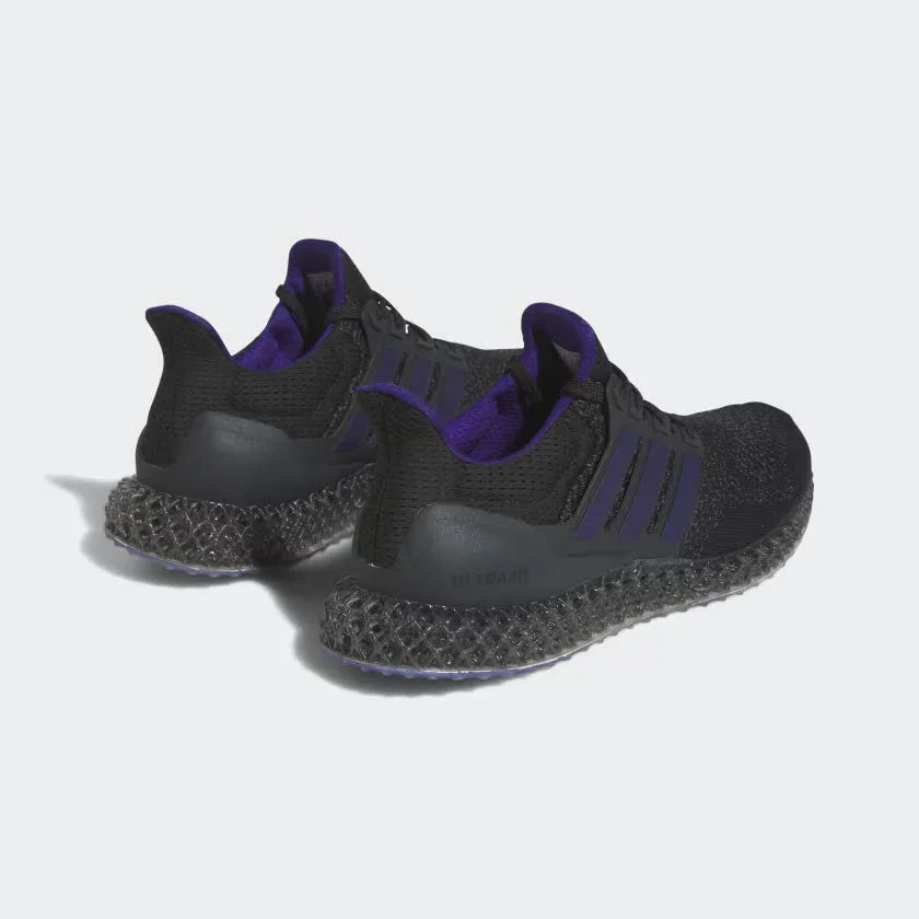 Rear angled view of two Adidas Ultra 4D x Rich Mnisi Pride men's trainers, side by side, showcasing their bold design and groundbreaking 4D technology.