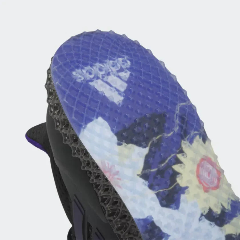Detailed zoom on the outsole and midsole of the Adidas Ultra 4D x Rich Mnisi Pride men's trainers, highlighting the dual-pressure Dynamic Air cushioning system and robust rubber outsole.