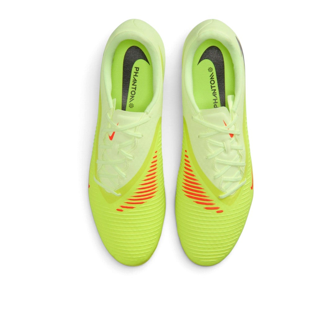 Overhead view of both football boots showing the central lacing system, textured striking zones with Hyper Crimson detailing, and interior PHANTON branding on the insoles.