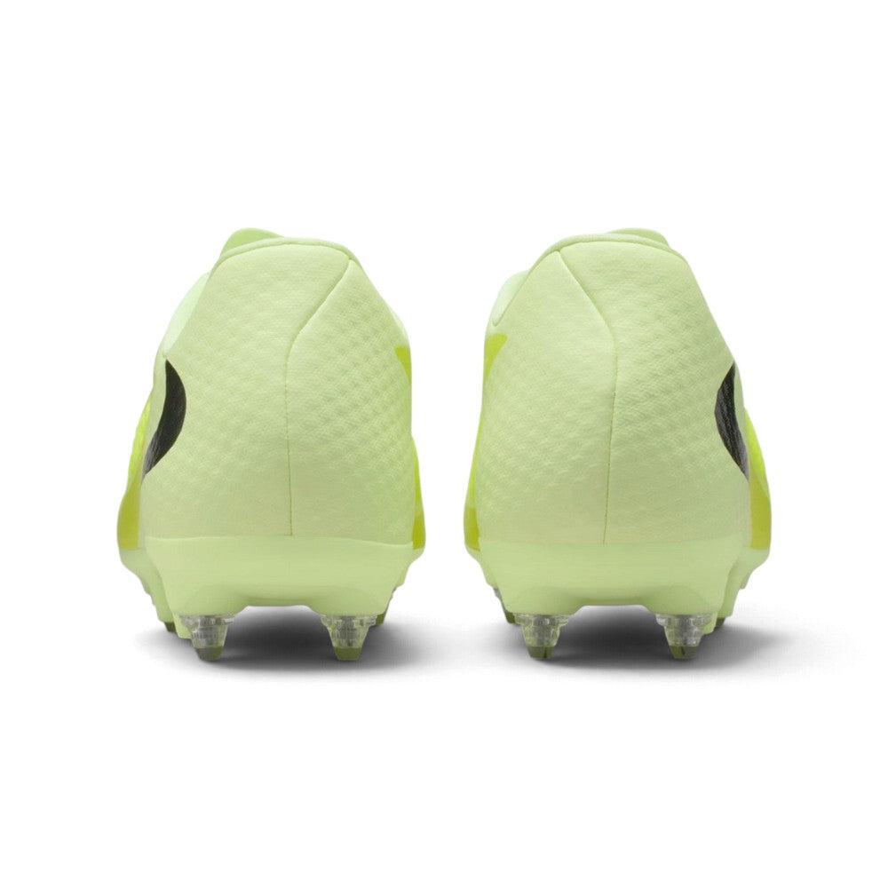 Rear view of the boots focusing on the padded heel counters, smooth lime green finish, and the rear metal studs.