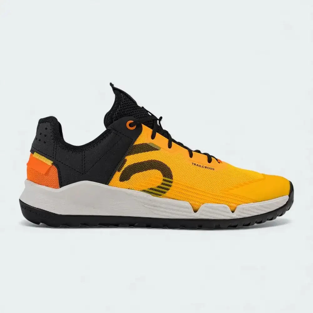 Adidas Five Ten Trailcross LT men's mountain biking shoes in solar gold and black, side profile showing the Stealth rubber outsole and breathable textile upper. Main image