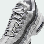 Close-up zoom on the front of the Nike Air Max 95 Men's running shoes, showing the intricate lacing system, mesh tongue, and layered overlays.