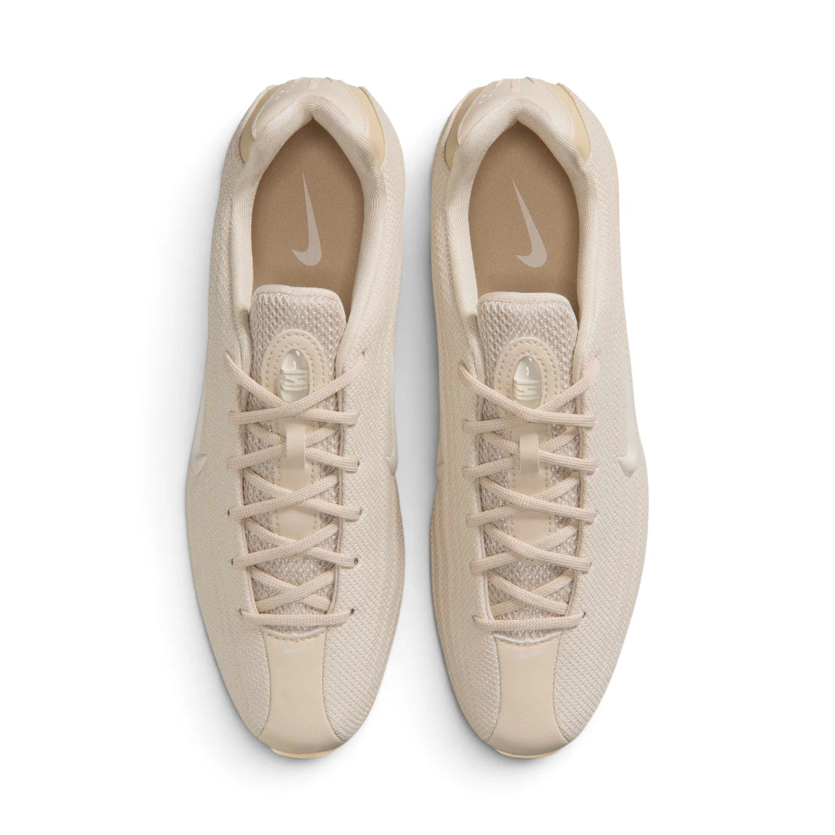 Top-Down View of Pair: Overhead view looking down at the laced oatmeal trainers, displaying the tonal flat laces, technical mesh tongue, and branded insoles.   